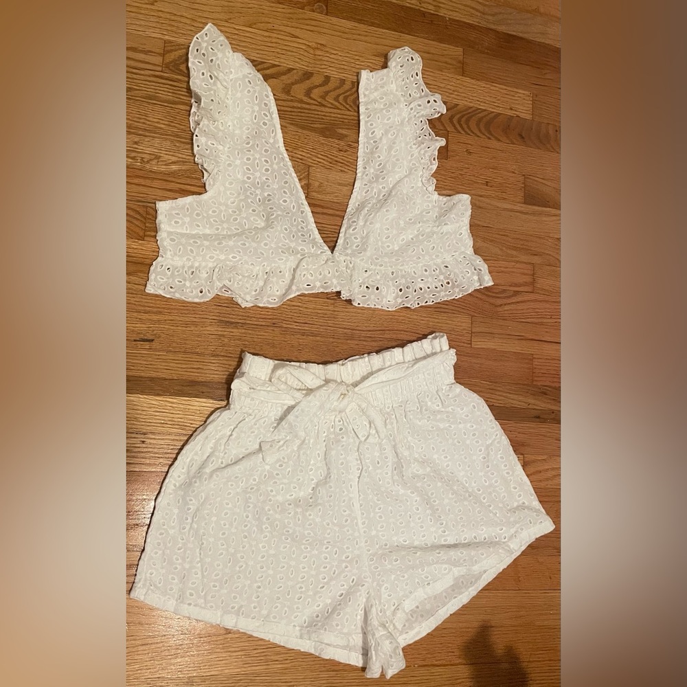 Two piece ruffled white short set with cropped top.